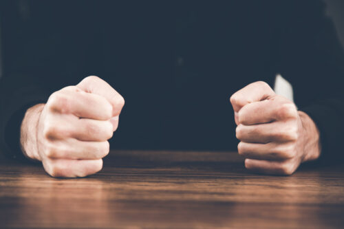 fists banging table