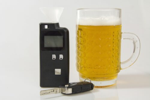 breathalyzer, beer, and car key